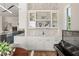 Butler's pantry featuring elegant cabinetry, a sink, and stylish backsplash at 705 N Lake Sybelia Dr, Maitland, FL 32751