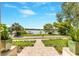Beautifully landscaped view to the water, showcasing lush greenery and a serene setting at 705 N Lake Sybelia Dr, Maitland, FL 32751