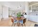 Open-concept living, dining, and kitchen area with modern finishes and natural light at 705 N Lake Sybelia Dr, Maitland, FL 32751