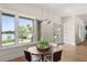 Charming dining space offering picturesque views of the waterfront and lush surroundings at 705 N Lake Sybelia Dr, Maitland, FL 32751