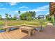 Wooden dock with bench seating, perfect for relaxing by the lake and enjoying the beautiful waterfront scenery at 705 N Lake Sybelia Dr, Maitland, FL 32751