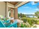Inviting covered front porch with comfortable seating and scenic lake views at 705 N Lake Sybelia Dr, Maitland, FL 32751