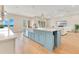Gourmet kitchen features center island, high-end appliances, and views of the water at 705 N Lake Sybelia Dr, Maitland, FL 32751