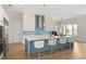 Island kitchen features stainless appliances, ample counter space, and pendant lighting at 705 N Lake Sybelia Dr, Maitland, FL 32751