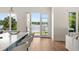 Bright living space featuring an open floorplan and scenic waterfront views at 705 N Lake Sybelia Dr, Maitland, FL 32751