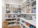 Walk-in pantry with custom shelving, countertop space, and ample storage at 705 N Lake Sybelia Dr, Maitland, FL 32751