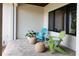 Cozy patio featuring comfortable chairs, stylish decor, and inviting atmosphere for outdoor relaxation at 705 N Lake Sybelia Dr, Maitland, FL 32751