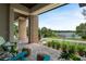 Inviting covered patio with serene lake views, comfortable seating, and stylish decor for relaxation at 705 N Lake Sybelia Dr, Maitland, FL 32751