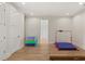 Spacious recreation room with wood floors, ample lighting, and gymnastic equipment at 705 N Lake Sybelia Dr, Maitland, FL 32751