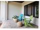 Cozy outdoor sitting area on the porch with comfortable Adirondack chairs, ideal for relaxation at 705 N Lake Sybelia Dr, Maitland, FL 32751