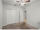 Bedroom with closet, ceiling fan, and a door opening to another room at 714 Golden Elm Dr, Apopka, FL 32703