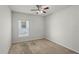 Carpeted bedroom featuring a window and neutral decor at 714 Golden Elm Dr, Apopka, FL 32703