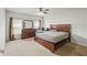 Spacious bedroom features neutral walls, two windows, and a ceiling fan at 714 Golden Elm Dr, Apopka, FL 32703