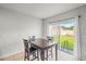 Bright dining area features a sliding glass door leading to the backyard at 714 Golden Elm Dr, Apopka, FL 32703
