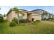 Attractive home featuring a manicured lawn, mature landscaping, and a two-car garage that adds to the property's charm at 714 Golden Elm Dr, Apopka, FL 32703