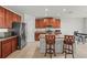 Modern kitchen with granite counters, stainless appliances, and island with seating at 714 Golden Elm Dr, Apopka, FL 32703