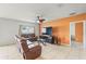Comfortable living room with tile floors, ceiling fan, and neutral wall colors at 714 Golden Elm Dr, Apopka, FL 32703