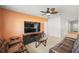 Welcoming living room showcasing tile floors, tv, and comfortable seating at 714 Golden Elm Dr, Apopka, FL 32703