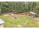 Expansive backyard with a fire pit, hot tub, and outdoor living area, ideal for relaxation and entertainment at 723 River Run Rd, Osteen, FL 32764