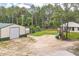 Expansive backyard featuring a large building, garden, and play area at 723 River Run Rd, Osteen, FL 32764