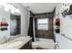 Bathroom features granite vanity, bathtub with stone-look tile and a shower curtain at 723 River Run Rd, Osteen, FL 32764