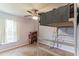 Cozy bedroom featuring a unique loft bed, window, and neutral carpet at 723 River Run Rd, Osteen, FL 32764