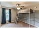 Bright bedroom with a loft bed, ceiling fan, and natural light from the window at 723 River Run Rd, Osteen, FL 32764