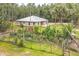 Inviting home with landscaped garden, mature trees, and well maintained lawn at 723 River Run Rd, Osteen, FL 32764