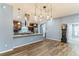 A kitchen featuring stainless steel appliances, granite countertops, and modern pendant lighting at 723 River Run Rd, Osteen, FL 32764