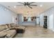 Open living area with wood-look flooring, modern lighting, and a spacious layout at 723 River Run Rd, Osteen, FL 32764