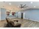 Open living area features wood-look flooring, modern lighting, and an open layout at 723 River Run Rd, Osteen, FL 32764
