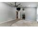 Spacious main bedroom featuring a ceiling fan, neutral color palette, and ensuite bathroom at 723 River Run Rd, Osteen, FL 32764