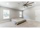 Serene main bedroom with a large ceiling fan, neutral tones, and plenty of natural light at 723 River Run Rd, Osteen, FL 32764