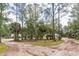 Spacious lot with mature trees and an array of outbuildings including a playground and utility shed at 723 River Run Rd, Osteen, FL 32764