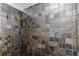 Tiled shower featuring a rainfall showerhead and neutral tile design at 723 River Run Rd, Osteen, FL 32764