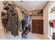 Functional walk-in closet with custom wood shelving and ample storage space at 723 River Run Rd, Osteen, FL 32764