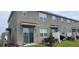 Backyard with a sliding glass door and a small patio area for outdoor entertaining at 741 Spring Palms Loop, Orlando, FL 32828