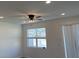 Well-lit bedroom with a ceiling fan, recessed lights, and a window providing natural light and a view at 741 Spring Palms Loop, Orlando, FL 32828
