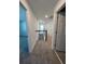 Upstairs hallway with neutral carpet, leading to bedrooms and bathrooms with white doors at 741 Spring Palms Loop, Orlando, FL 32828