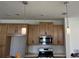 Bright kitchen featuring stainless steel appliances, quartz countertops, and elegant pendant lighting at 741 Spring Palms Loop, Orlando, FL 32828