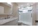 Bright bathroom featuring marble countertop, white cabinetry, and tiled glass shower at 789 Barger Dr, Deltona, FL 32738