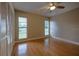 Spacious bedroom with hardwood floors, ceiling fan, and abundant natural light at 789 Barger Dr, Deltona, FL 32738