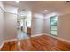 Bedroom with beautiful hardwood floors and a large window that offers great outdoor views at 789 Barger Dr, Deltona, FL 32738