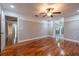 Spacious bedroom with hardwood floors, a ceiling fan, and access to a bathroom at 789 Barger Dr, Deltona, FL 32738