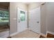 Entryway featuring a decorative glass door, tile flooring, and a built-in bench at 789 Barger Dr, Deltona, FL 32738