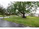 Home with a spacious front yard and driveway, offering great curb appeal and plenty of parking at 789 Barger Dr, Deltona, FL 32738