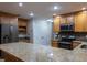Spacious kitchen with stainless appliances, granite counters, breakfast bar, and custom cabinetry; a chef's dream at 789 Barger Dr, Deltona, FL 32738