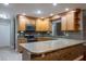 Bright kitchen with updated stainless appliances, stone counters, breakfast bar, and ample storage space at 789 Barger Dr, Deltona, FL 32738