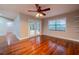 Bright living room with hardwood floors, ceiling fan, and access to patio at 789 Barger Dr, Deltona, FL 32738
