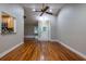 Spacious living area with hardwood floors and access to the kitchen and entry at 789 Barger Dr, Deltona, FL 32738